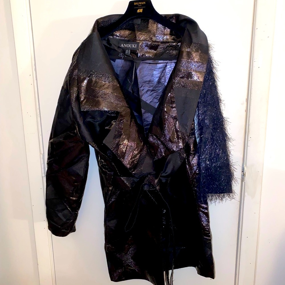 Off-the-shoulder statement coat by ANOUKI